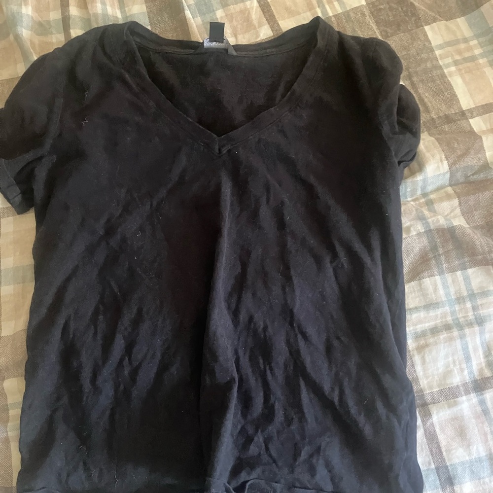 Black T-shirt and purple leggings